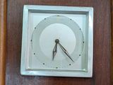 a clock that is on the wall in the room