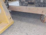 a large piece of luggage sitting on a dolly in a warehouse