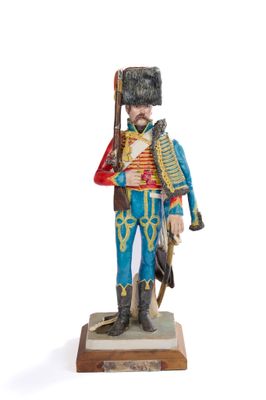 figurine of a toy soldier with a rifle and uniform