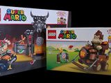 two boxes of lego super marios and a box of legos