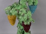 a lamp that has a bunch of grapes on it