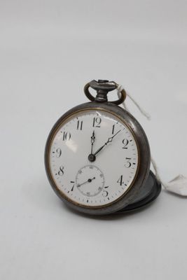 a pocket watch that is sitting on top of a table