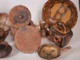 many different types of baskets and bowls on the table
