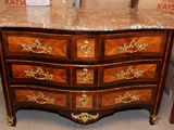 a marble top chest of drawers in a store