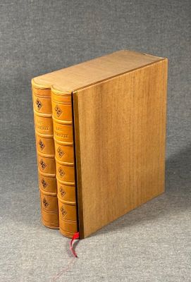 an image of two books sitting on top of each other on a table