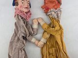 two puppets of a man and a woman are standing next to each other