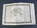 an old book with a map of the world on it