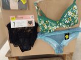 a cardboard box with a bra and panties on it