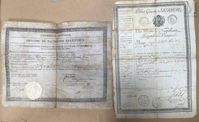 an old document sitting on top of a cardboard box next to a pair of scissors