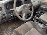 a yellow car with a steering wheel and a dashboard
