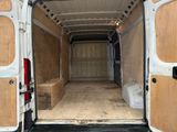 a white van that has a wooden door in the back of it