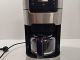 the coffee maker is on the counter ready to be used