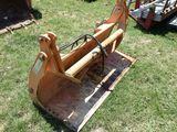 a small bulldozer that is sitting in the grass