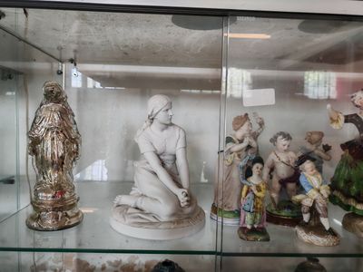 many figurines on display in a glass case
