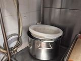 a pot and pan sitting on a shelf in a kitchen