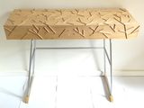 a wooden table with sticks on it in a room