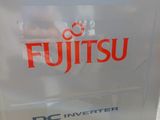 a sign that says atlantic to fujisu on the side of a building