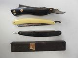 four different types of knives are displayed on a white surface