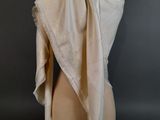 beige silk shawl draped over a mannequin head