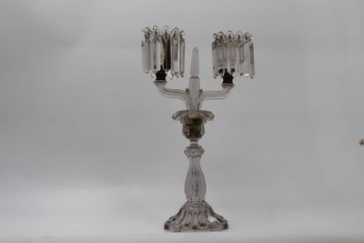 silver plated candelabra with three candles on a stand