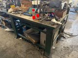 a workbench with a lot of tools on top of it