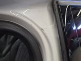 a close up of a car ' s door handle and the door handle of the car