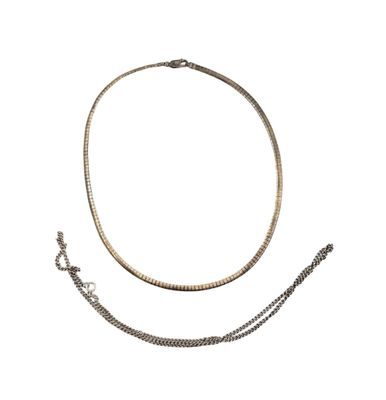 a close up of a necklace and a chain on a white background