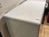an image of a small white refrigerator in a room