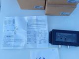 a box of boxes and a remote control on a table