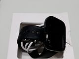 a black apple watch sitting in a white box on a table