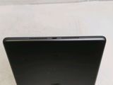 a black laptop computer sitting on a white surface