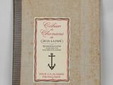 an old book with a picture of an anchor on it