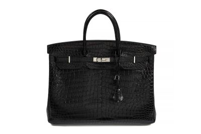 a black leather handbag on a white background