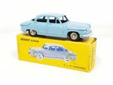 a blue toy car sitting on top of a yellow box