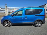 a blue van that is parked in the parking lot