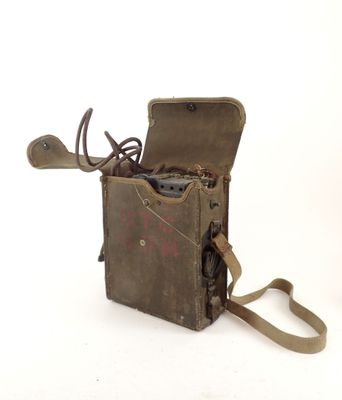 an old camera that is sitting on a white surface