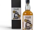 an image of a bottle of whisky next to a box