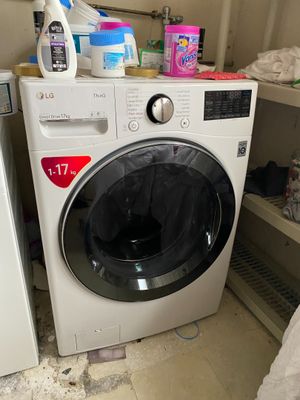 a washer and a dryer in a dirty room