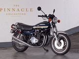 a motorcycle that is parked in front of a wall