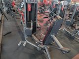 a gym with a lot of machines in the room