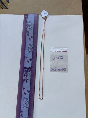 a picture of a bookmark and a ruler in a box