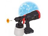 a close up of a spray gun with an orange ball in the background