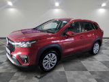 a red suv parked on a checkered floor in a garage