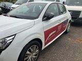 a white car with a red stripe parked in a parking lot