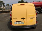 a yellow van that is parked in a parking lot
