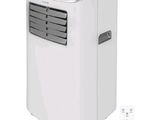 a white portable air conditioner sitting on top of a white table