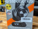 a box of steelseries headphones sitting on top of a wooden table