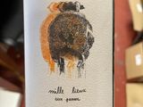 a bottle of wine that is sitting on a table