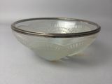 a glass bowl that is sitting on a table