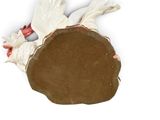 a piece of chocolate cake on a white surface